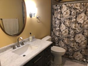 Bathroom Remodeling in Williamsburg, VA. Full Bathroom remodeled; new drywall finished and painted, new wiring, lighting, vanity and vanity top, tiling and sink plumbing. (1)