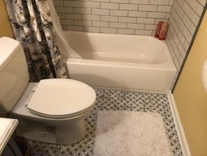 Bathroom Remodeling in Williamsburg, VA. Full Bathroom remodeled; new drywall finished and painted, new wiring, lighting, vanity and vanity top, tiling and sink plumbing. (2)
