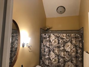 Bathroom Remodeling in Williamsburg, VA. Full Bathroom remodeled; new drywall finished and painted, new wiring, lighting, vanity and vanity top, tiling and sink plumbing. (4)